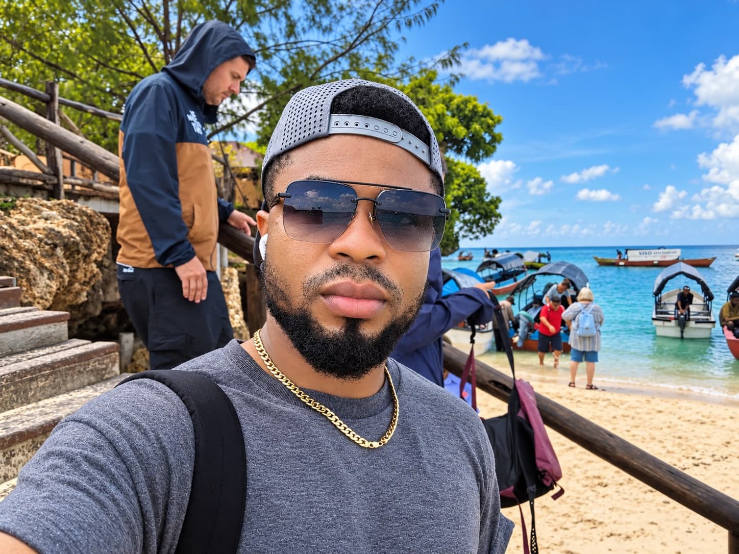 Oscar Frank taking a selfie at a harbour